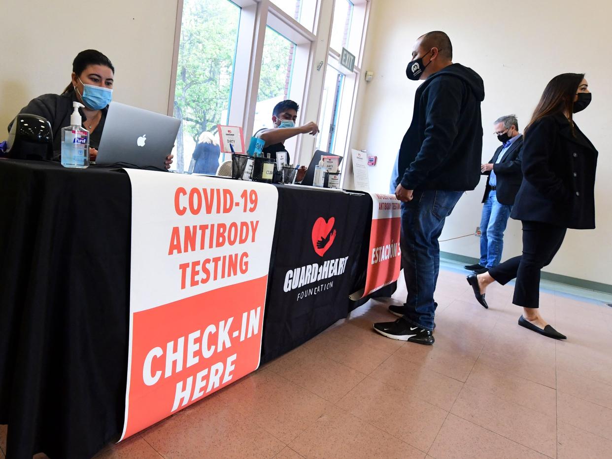 People arrive for the new FDA emergency use and authorized IgG ll Antibody Test for vaccinated people, offered free of charge in Santa Fe Springs, California, on April 21, 2021 (AFP via Getty Images)