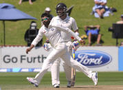 India’s Ravindra Jadeja reacts against New Zealand on the fourth day of the second cricket test at Basin Reserve in Wellington, New Zealand, Monday, Feb. 17, 2014.
