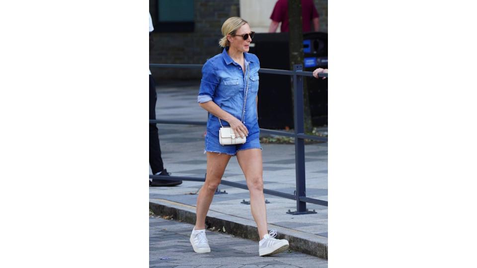 Zara Tindall walking in a denim outfit