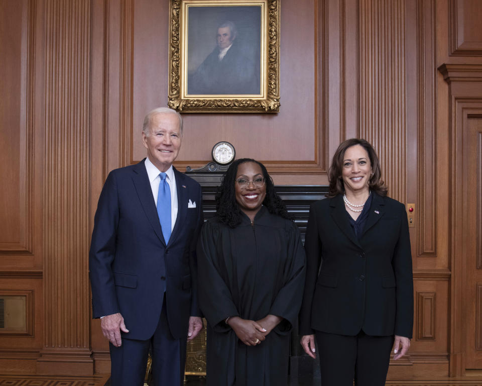 In this image provided by the Supreme Court, Associate Justice Ketanji Brown Jackson, center, poses for a photo with President Joe Biden, left, and Vice President Kamala Harris during her formal investiture ceremony at the Supreme Court in Washington, Friday, Sept. 30, 2022. (Fred Schilling/U.S. Supreme Court via AP)
