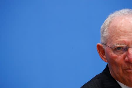 FILE PHOTO: German Finance Minister Wolfgang Schaeuble presents draft budget for 2018 and mid-term plans for state spending until 2021 during a news conference in Berlin, Germany, March 15, 2017. REUTERS/Fabrizio Bensch/File Photo