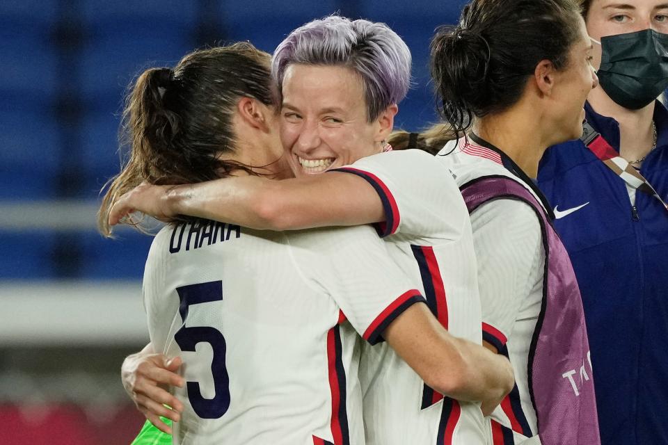 USWNT forward Megan Rapinoe, center, hugs defender Kelley O'Hara after their win over the Netherlands in the quarterfinals of the Tokyo Olympics.