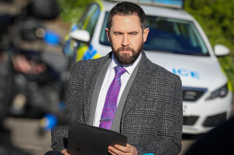 Detective Superintendent Lewis Hughes addresses reporters outside Blackleach Country Park in Walkden, Salford