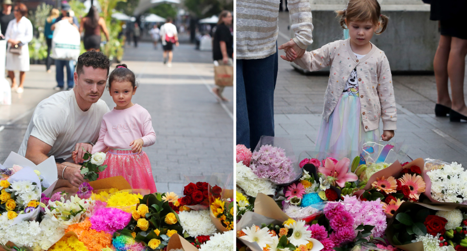 A father and a little girl (left) and a woman and a little girl (right) leaving flowers at the memorial.