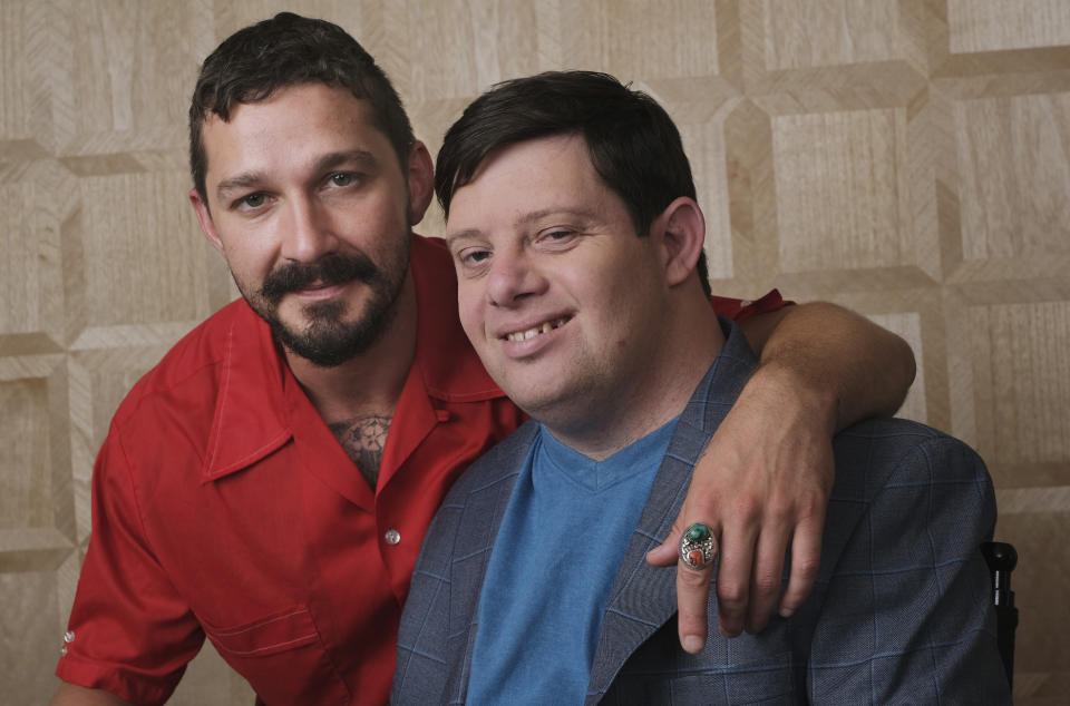 In this Friday, Aug. 2, 2019 photo, Shia LaBeouf, left, and Zack Gottsagen, cast members in the film "The Peanut Butter Falcon," pose together for a portrait at the London West Hollywood, in West Hollywood, Calif. The movie opens in the U.S. on Aug. 9. (Photo by Chris Pizzello/Invision/AP)