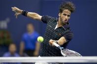 Feliciano Lopez of Spain hits the ball to Novak Djokovic of Serbia in their quarterfinal match at the U.S. Open Championships tennis tournament in New York, September 9, 2015. REUTERS/Carlo Allegri