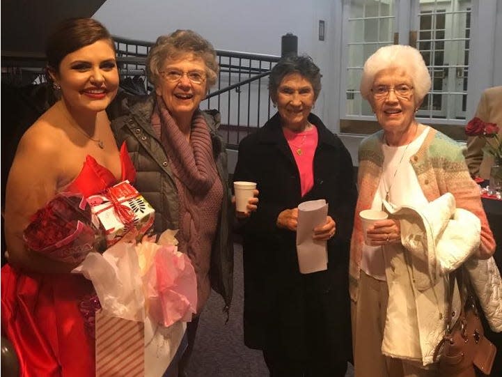 Gabrielle Clutter with women from Deerfield's senior living community.