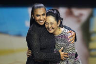 Brazil's soccer player Marta, left, gets a hug from Pele widow Marcia Aoki when accepting the FIFA Special award for her outstanding career achievements during the FIFA Football Awards 2023 at the Eventim Apollo in Hammersmith, London, Monday, Jan. 15, 2024. (AP Photo/Kirsty Wigglesworth)