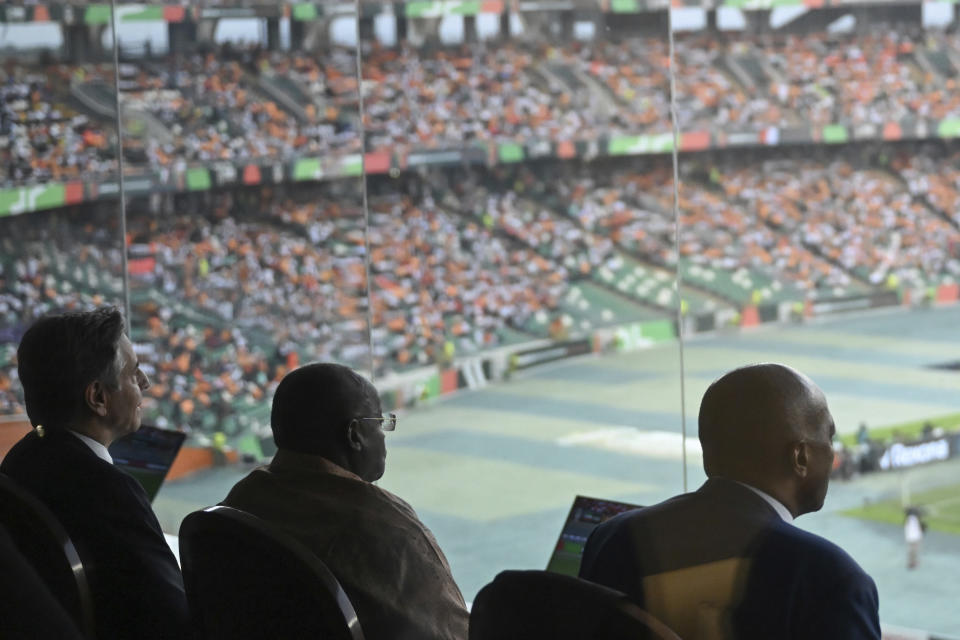 US Secretary of State Antony Blinken, left, and President of the Confederation of African Football (CAF) Patrice Motsepe, right, attend the Africa Cup of Nations (CAN) 2024 group A soccer match between Equatorial Guinea and Ivory Coast at the Alassane Ouattara Stadium in Ebimpe, Abidjan Abidjan, Ivory Coast, Monday, Jan. 22, 2024. (Andrew Caballero-Reynolds/Pool Photo via AP)