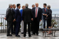 <p>President Donald Trump gathers with (L-R) European Commission President Jean-Claude Juncker, European Council President Donald Tusk, Japanese Prime Minister Shinzo Abe, German Chancellor Angela Merkel, Italian Prime Minister Paolo Gentiloni, French President Emmanuel Macron, Canadian Prime Minister Justin Trudeau and Britainís Prime Minister Theresa May as they attend the G7 Summit in Taormina, Sicily, Italy, May 26, 2017. (Photo: Jonathan Ernst/Reuters) </p>