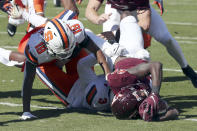 Virginia Tech running back Malachi Thomas (24) scores a touchdown past Syracuse's Mikel Jones (3) and Rob Hanna (19) during the first half of an NCAA college football game in Blacksburg Va., Saturday, Oct. 23 2021. (Matt Gentry/The Roanoke Times via AP)