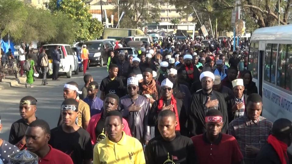 Shiite sheikhs (in white headdresses) lead an Ashoura procession in Arusha, Tanzania, 2022. Zaynu Yusuf Dachi, <a href="http://creativecommons.org/licenses/by/4.0/" rel="nofollow noopener" target="_blank" data-ylk="slk:CC BY;elm:context_link;itc:0;sec:content-canvas" class="link ">CC BY</a>