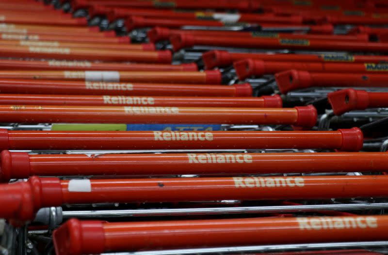 FILE PHOTO: Shopping trolleys are seen parked outside a Reliance supermarket in Mumbai