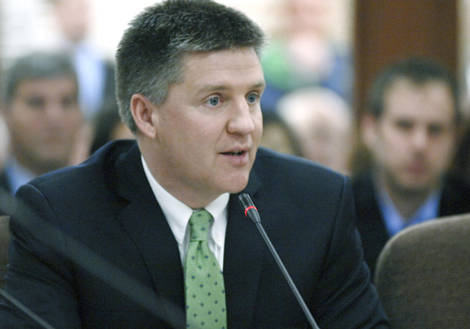 Ron Ness, North Dakota Petroleum Council President, testifies in front of officials with the Oil and Gas Division of the North Dakota Mineral Resources Department at a hearing Tuesday, April 22, 2014, in Bismarck, N.D. The North Dakota Industrial Commission was holding the hearing on its new natural gas flaring policy. (AP Photo/The Bismarck Tribune, Mike McCleary)