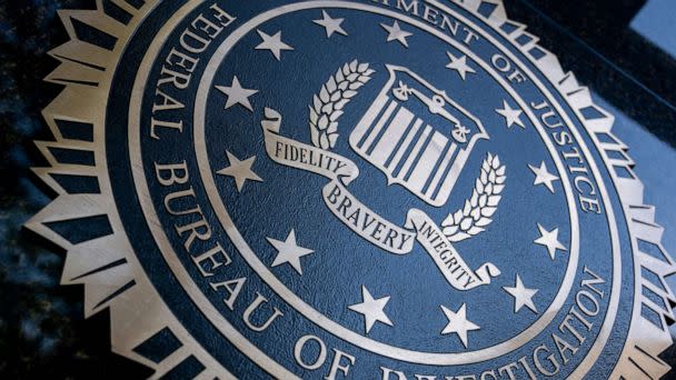 PHOTO: A seal reading 'Department of Justice Federal Bureau of Investigation' is displayed on the J. Edgar Hoover FBI building in Washington, DC, on August 9, 2022. (Stefani Reynolds/AFP via Getty Images)