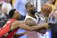 May 19, 2016; Cleveland, OH, USA; Toronto Raptors guard Kyle Lowry (7) fouls Cleveland Cavaliers forward LeBron James (23) during the second half in game two of the Eastern conference finals of the NBA Playoffs at Quicken Loans Arena. The Cavaliers won 108-89. Mandatory Credit: Ken Blaze-USA TODAY Sports
