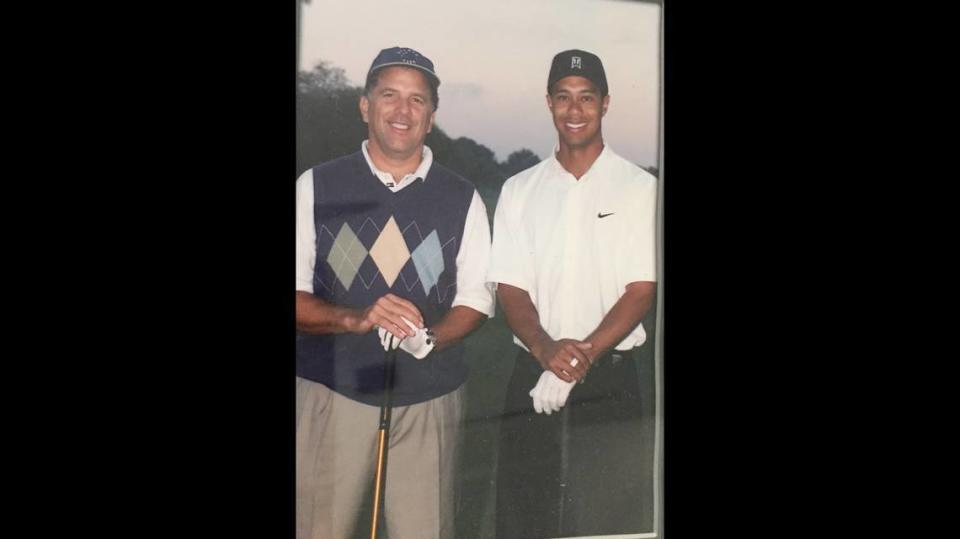 Andrew Kowalczyk, left, with Tiger Woods.