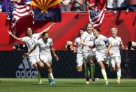 Jul 5, 2015; Vancouver, British Columbia, CAN; United States midfielder Carli Lloyd (10) celebrates with teammates after scoring against Japan during the first half of the final of the FIFA 2015 Women's World Cup at BC Place Stadium. Michael Chow-USA TODAY Sports