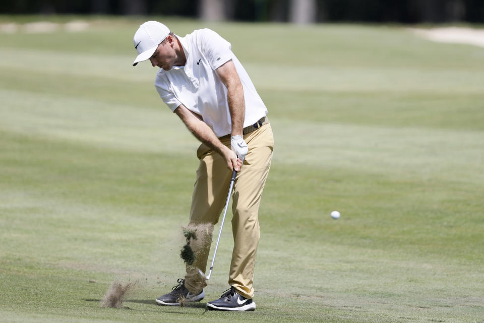 Russell Henley hits to the 18th green during the final round of the John Deere Classic golf tournament, Sunday, July 14, 2019, at TPC Deere Run in Silvis, Ill. (AP Photo/Charlie Neibergall)