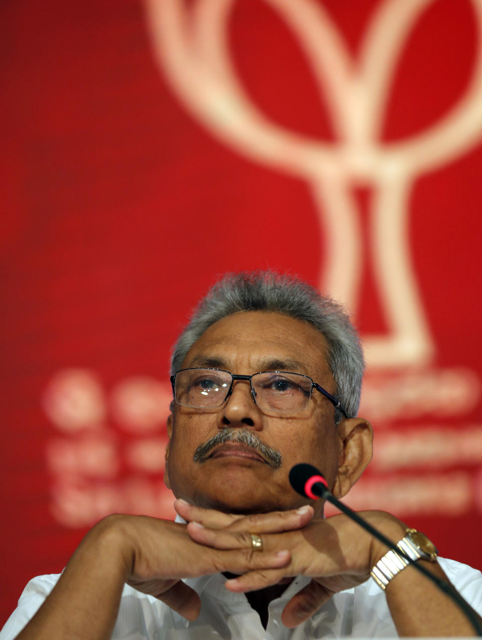 Sri Lankan presidential candidate and former defense chief Gotabaya Rajapaksa sits during a news conference in Colombo, Sri Lanka, Tuesday, Oct. 15, 2019. Rajapaksa, who's a front-runner in next month's presidential election says if he wins he won't recognize an agreement the government made with the U.N. human rights council to investigate alleged war crimes during the nation's civil war. (AP Photo/Eranga Jayawardena)