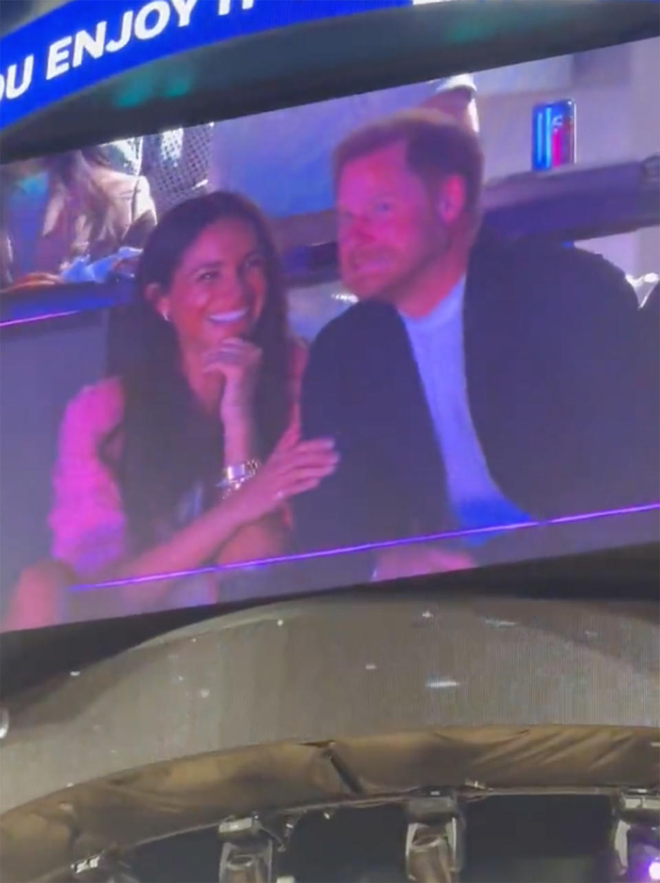 Meghan Markle laughing at Prince Harry at the NBA