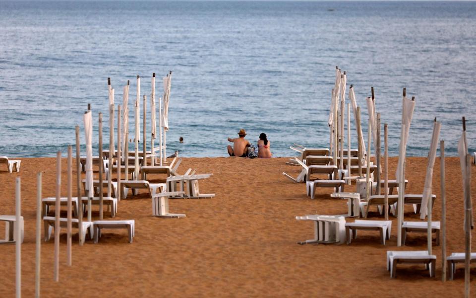 Beaches, like this in Albufeira, will remain quiet this summer in the absence of Britons - reuters