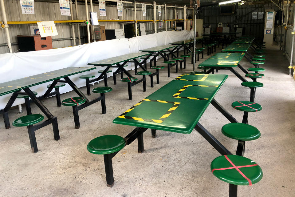 Safe distancing markers seen at the site's dining area, where catered meals are delivered to each day. (PHOTO: Dhany Osman / Yahoo News Singapore)