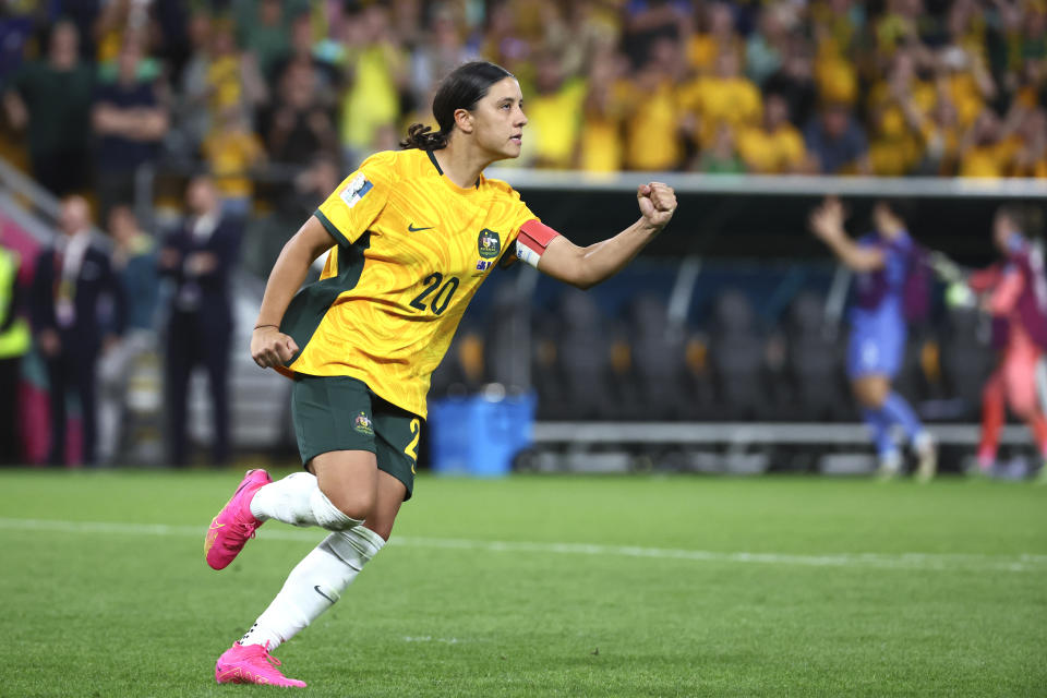 Australia's Sam Kerr celebrates after scoring during a penalty shootout during the Women's World Cup quarterfinal soccer match between Australia and France in Brisbane, Australia, Saturday, Aug. 12, 2023. (AP Photo/Tertius Pickard)
