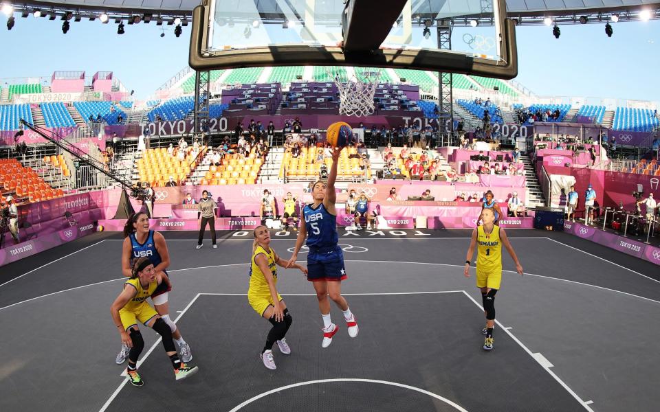 USA's Kelsey Plum drives to the basket against Romania - GETTY IMAGES