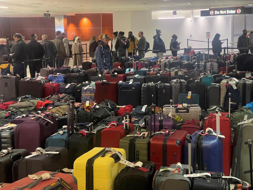 Hundreds of passengers wait in line to handle their baggage claim issues with Southwest Airlines at Baltimore/Washington International Thurgood Marshall Airport in Baltimore, Maryland on December 27, 2022.