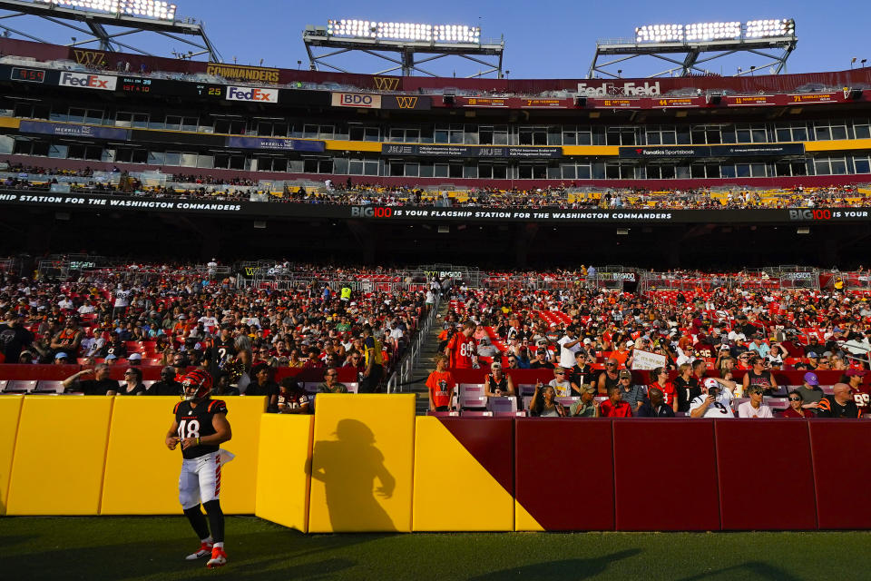 Cincinnati Bengals long snapper Cal Adomitis (48) working out on the sidelines during the first half of an NFL preseason football game against the Washington Commanders, Saturday, Aug. 26, 2023, in Landover, Md. (AP Photo/Julio Cortez)