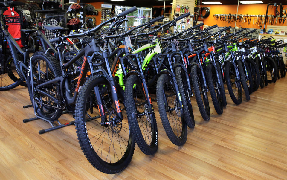 In this July 10, 2019, photo, mountain bikes are displayed at Cycles Etc bicycle shop in Salem, N.H. On Tuesday, July 16, the Commerce Department releases U.S. retail sales data for June. (AP Photo/Charles Krupa)