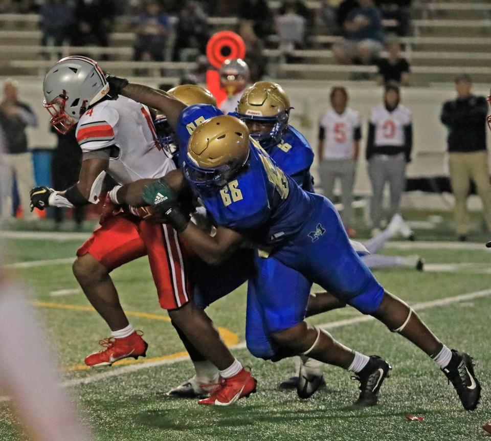 Ramon McCollough jr (66) Mainland’s defensive lineman tackles Isaiah Thomas (4) Lake Mary running back during Friday nights game on November 3, 2023 .