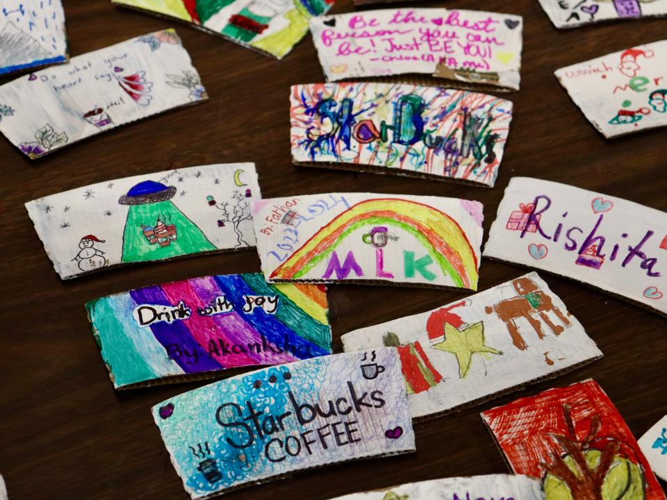 Students at Martin Luther King Intermediate School in Piscataway created unique designs on coffee cup sleeves to be given out at Starbucks. Art teacher Irina Nikitovic envisioned the idea to help spread kindness and show off her students’ work in the community.