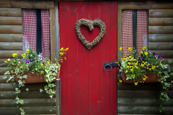 Heart shaped wreath on door of shed