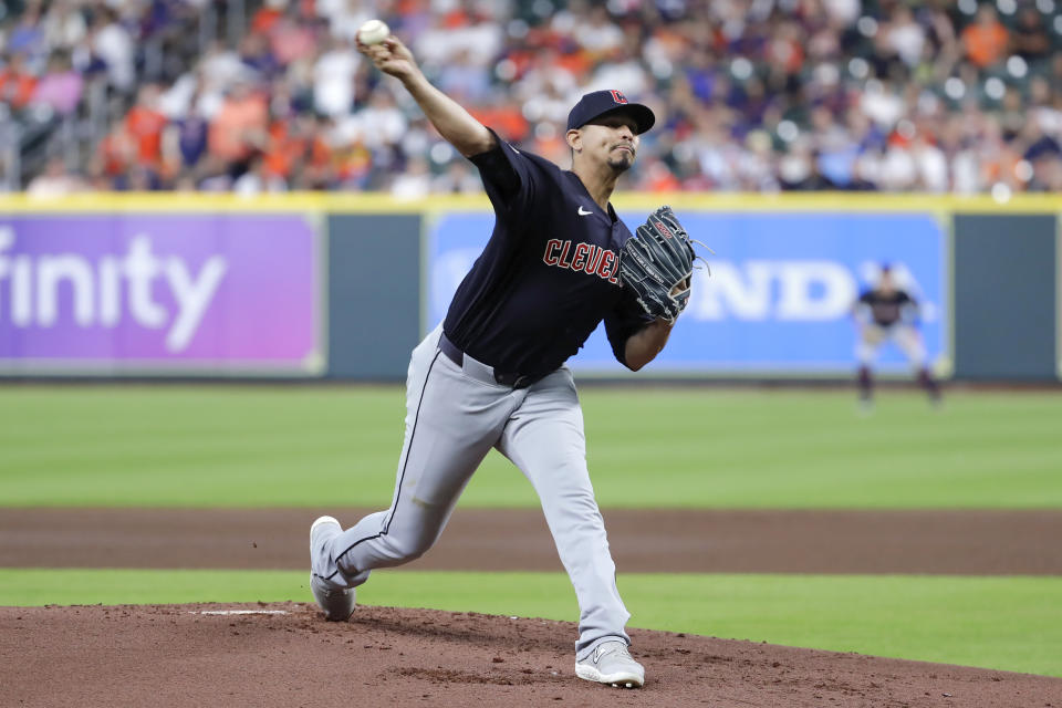 Cleveland Guardians starting pitcher Carlos Carrasco throws against the Houston Astros during the first inning of a baseball game Tuesday, April 30, 2024, in Houston. (AP Photo/Michael Wyke)