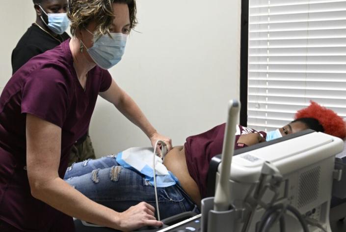 TUSCALOOSA, AL -APRIL 24, 2023: Dr. Leah Torres administers an Ultrasound on a 27-year-old woman who is 10 weeks pregnant at West Alabama Women&#39;s Clinic on April 24, 2023 in Tuscaloosa, Alabama. Once the busiest abortion clinic in this Deep South state, the West Alabama Women&#39;s Center in Tuscaloosa shut down briefly when Alabama banned all abortions. But it&#39;s reopened with a new focus and remains defiant. It&#39;s one of the few clinics committed to providing pre-natal care, birth control and miscarriage treatment to low income and uninsured patients in a state with the third highest maternal mortality rate and fifth highest infant death rate in the nation.(Gina Ferazzi / Los Angeles Times)