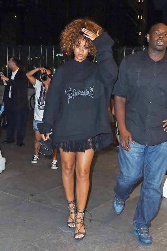 Rihanna in a Vetements oversized hoodie and heels.