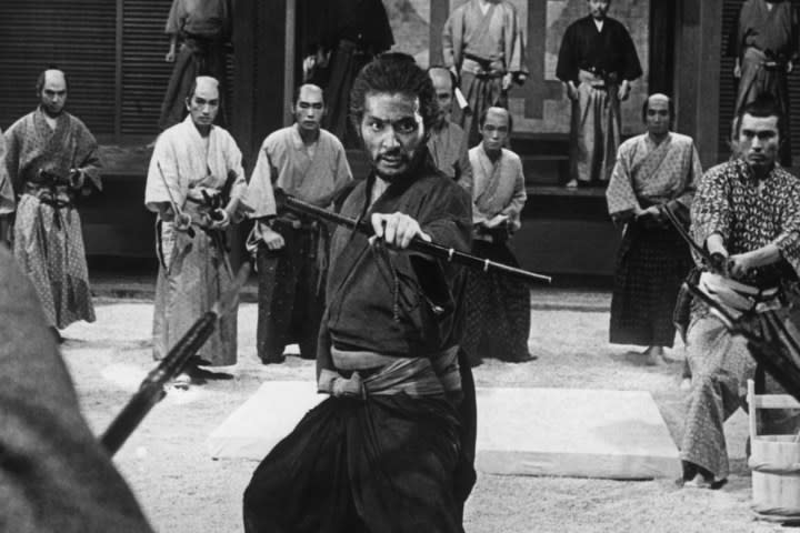 Tatsuya Nakadai holds a sheathed short sword in Harakiri.