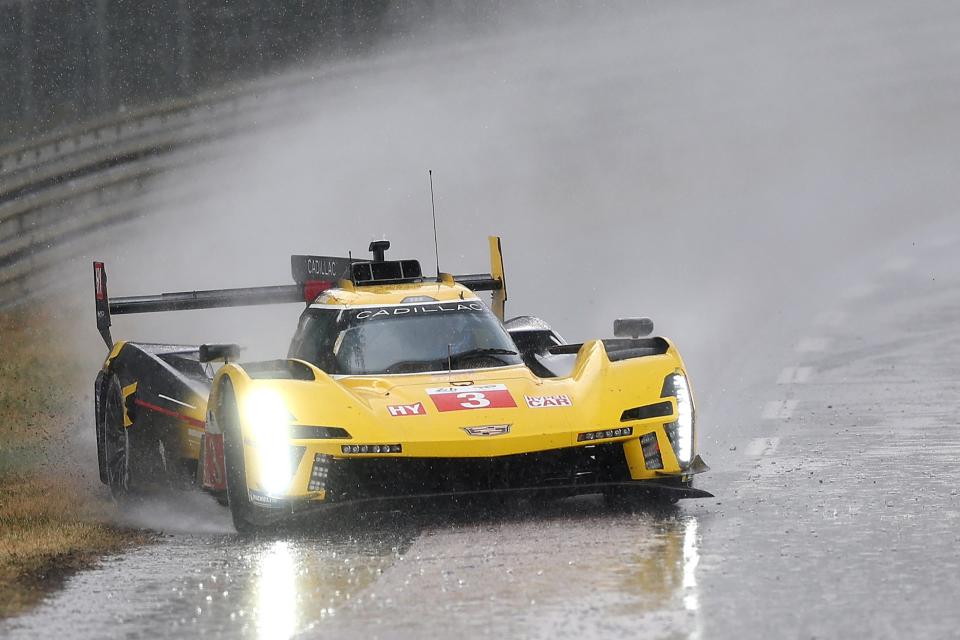 LE MANS, FRANCE - JUNE 10: The Cadillac Racing Cadillac V-Series.R driven by Sebastien Bourdais, Renger van der Zande and Scott Dixon spins out during a heavy rain shower during the 100th anniversary of the 24 Hours of Le Mans at the Circuit de la Sarthe on June 10, 2023 in Le Mans, France. (Photo by Clive Rose/Getty Images)