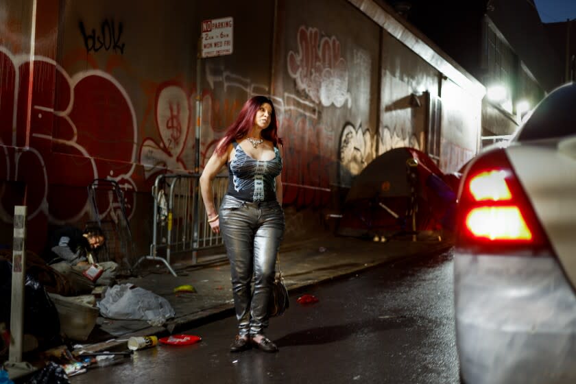 SAN FRANCISCO CA NOVEMBER 20, 2021 -Carla Gay speaks to a man wanting sex on Olive St. on Saturday, Nov. 20, 2021 in San Francisco, Calif.