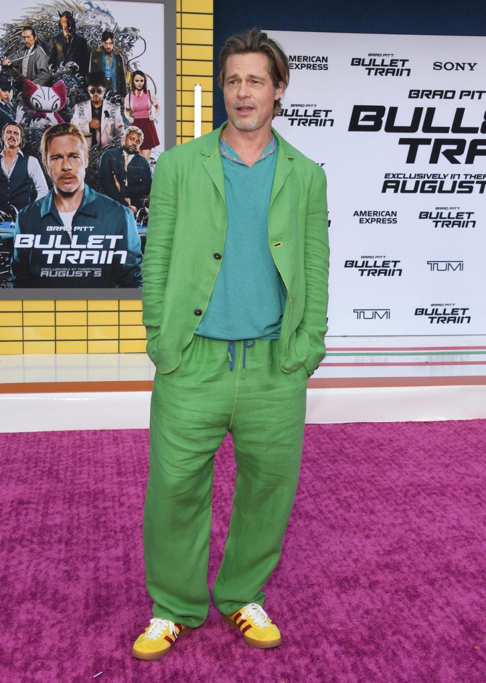 Brad Pitt made another bold fashion statement on Monday in this baggy green two-piece (Getty Images)