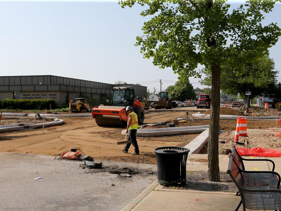 Selge Construction Co. workers prepare the roadbed for surfacing Wednesday, May 24, 2023, at Third and Main streets in downtown Mishawaka in hopes for it to be ready for the starting line for participants in the city’s Memorial Day parade.