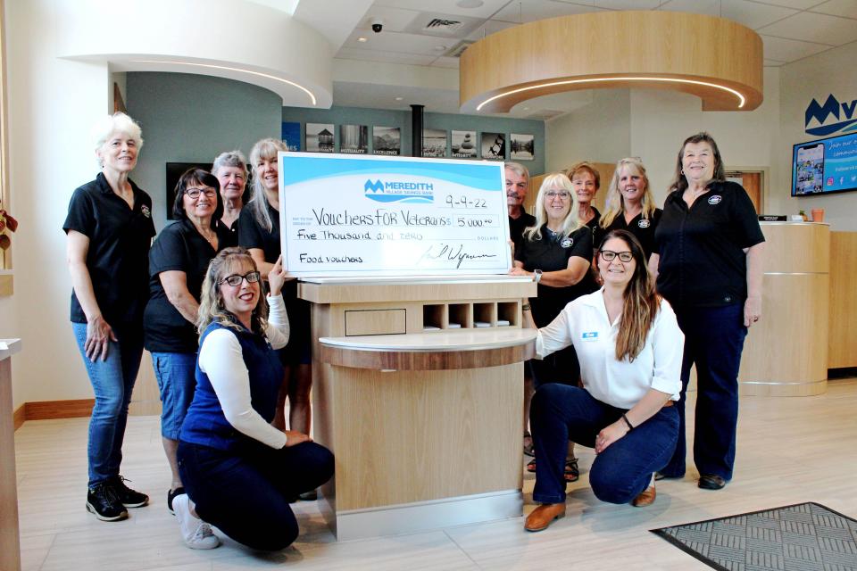 Jolene Whitehead, MVSB Branch & Business Development Manager, (left) and Nicole Ames, MVSB Mortgage Loan Officer NMLS #2370119, present a donation check to the volunteers at Voucher for Veterans at MVSB’s new Rochester branch.