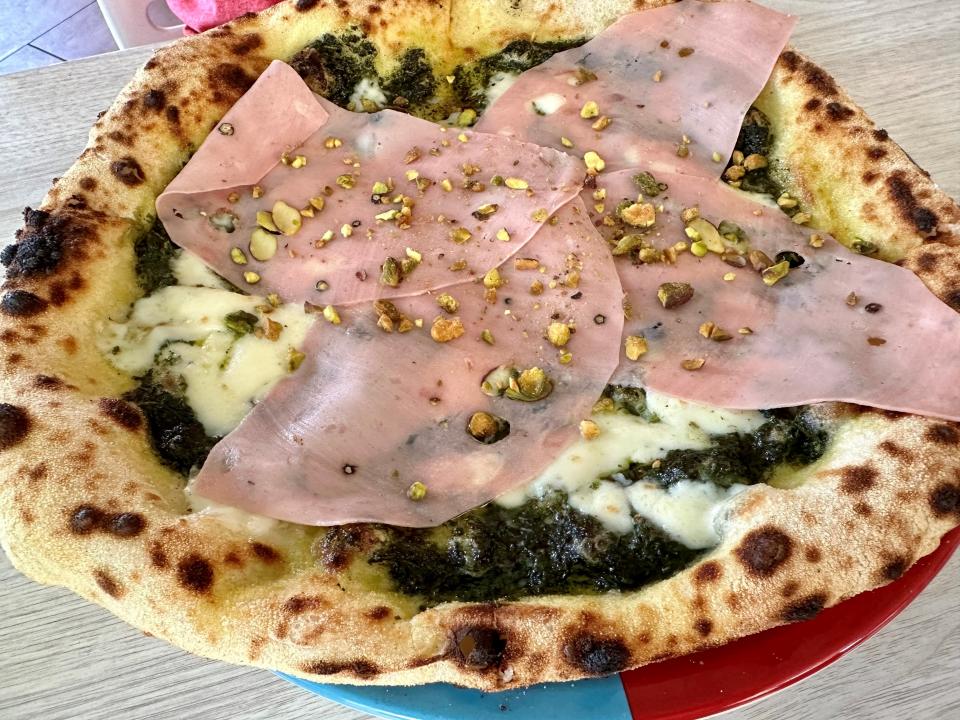 The mortadella pizza at Mangia e Bevi Pizzeria Napoletana in Cocoa Beach: "Beautifully done pesto, house-made mozzarella, thinly sliced mortadella ... crushed pistachios, shaved Parmesan, a little basil and extra-virgin olive oil," says restaurant reviewer Lyn Dowling.