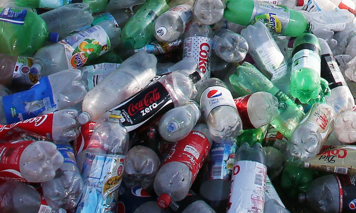<span>While plastic bottles will be included in the UK bottle deposit scheme, glass will not – except in Wales.</span><span>Photograph: Lynne Cameron/PA</span>