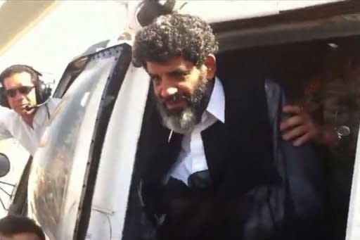 A handout video grab taken from footage shot by a member of Libyan security forces shows Abdullah al-Senussi, a former spy of late Libyan leader Moamer Kadhafi, arriving at the high security prison facility in Tripoli