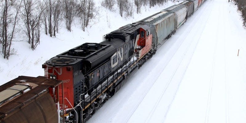 A Canadian National Railway train travels eastward on a track in Montreal, February 22, 2015. REUTERS/Christinne Muschi/File Photo 