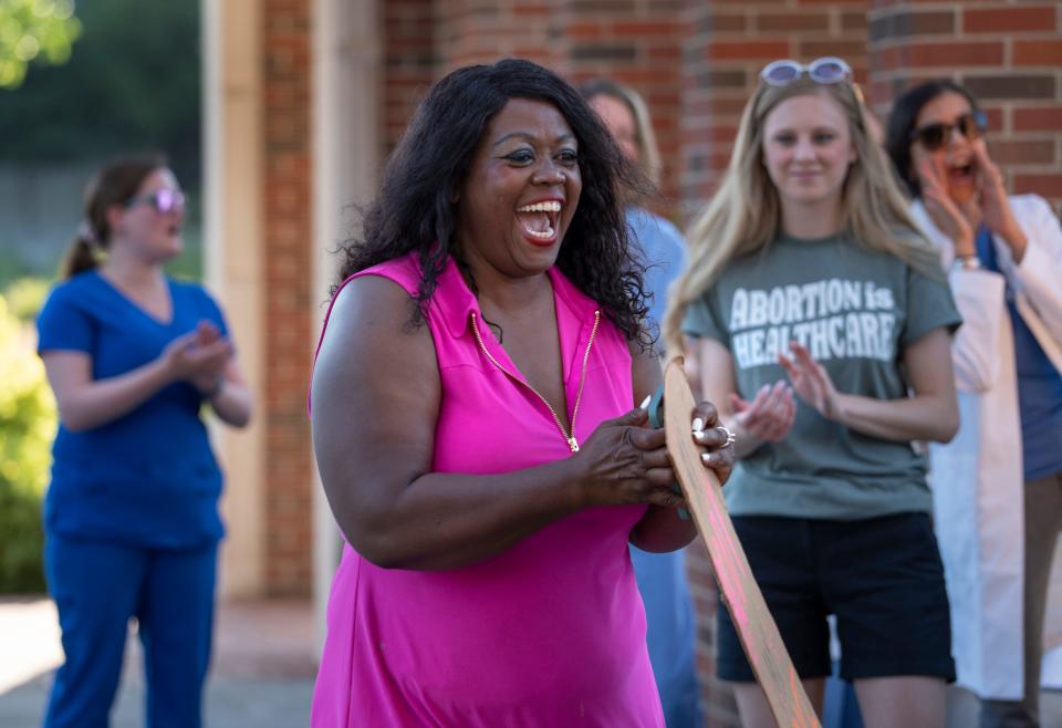 Jeannine Lee Lake, candidate for U.S. Congress, runs to the front for her turn to speak during the Reproductive Justice Rally, Wednesday, June 29, 2022 on the IIUPUI campus. 