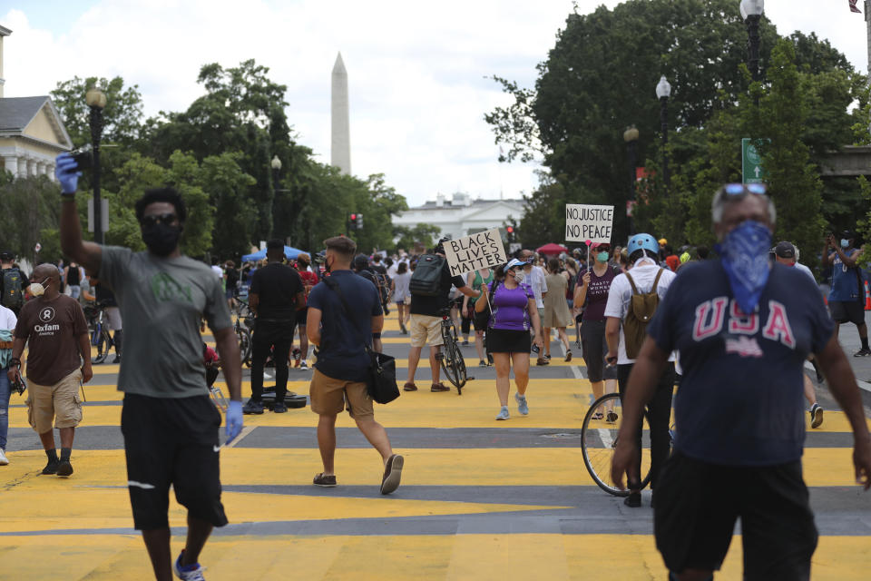 With the Washington Monument looming in the background, protesters march for racial justice on the streets of the District of Columbia near the White House on June 5. (Photo: mpi34/MediaPunch/MediaPunch/IPx)